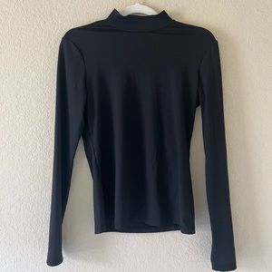 Black sheer half turtle neck in a size S